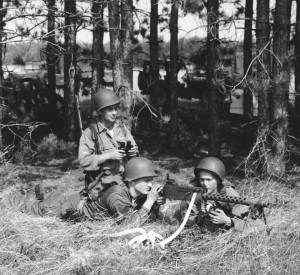 A machine gun team practicing setting up and spotting (MLive Editorial Camp Grayling)